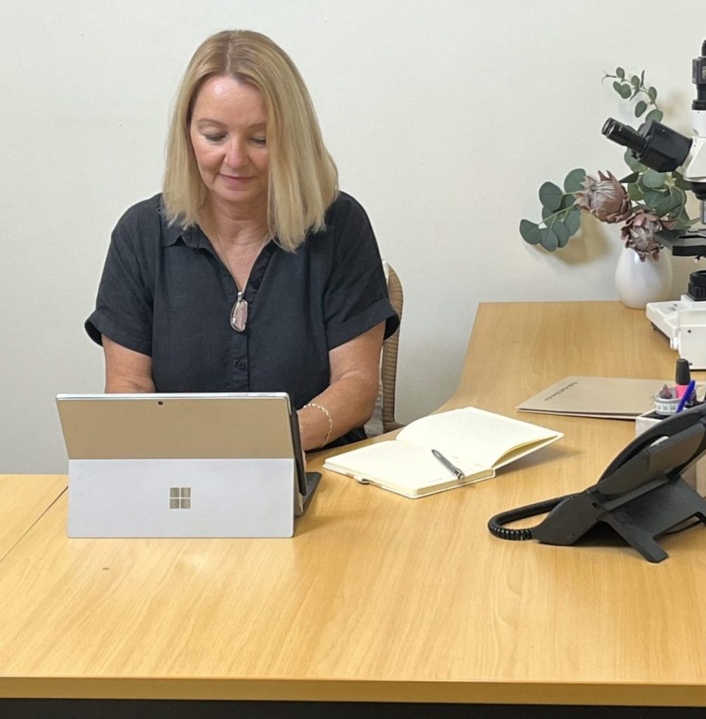 Ellen Smith working at desk