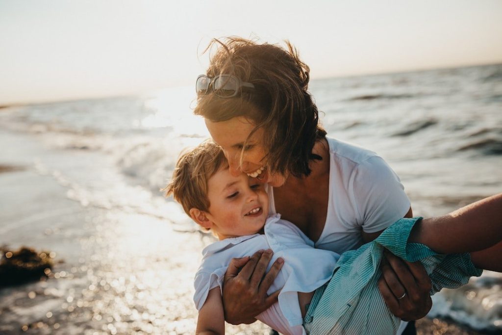 Lady with her son at beach
