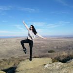 Lady balancing on a rock