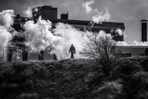 Man walking in smog and pollution